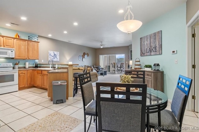 1181 Jeffries Rd Unit B107, Osage Beach, MO 65065 - dining area with ceiling fan, recessed lighting, and light tile patterned floors