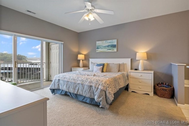 1181 Jeffries Rd Unit B107, Osage Beach, MO 65065 - bedroom with access to exterior, light carpet, a ceiling fan, and baseboards