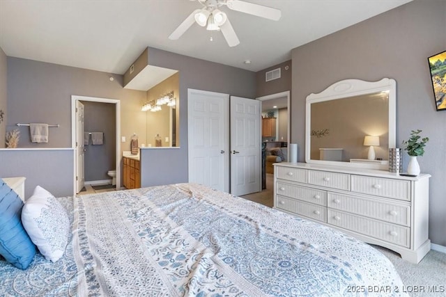 1181 Jeffries Rd Unit B107, Osage Beach, MO 65065 - bedroom featuring baseboards, ensuite bathroom, ceiling fan, and carpet floors