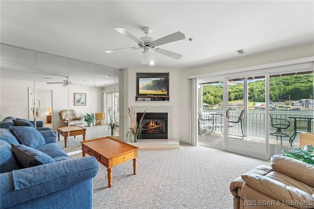 335 Vision Dr Unit 2B, Camdenton, MO 65020 - living room featuring a ceiling fan, plenty of natural light, and a fireplace