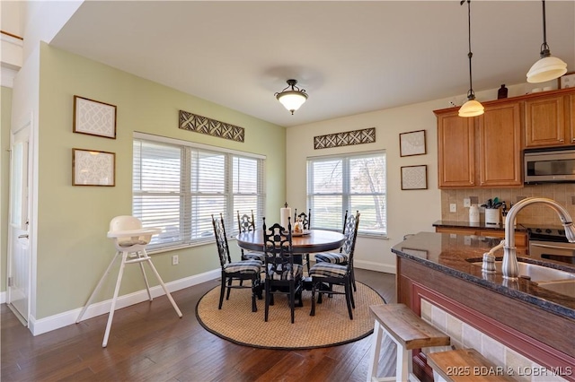 915 Bear Cave Way, Camdenton, MO 65020 - dining room with baseboards and dark wood-style flooring