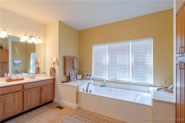 915 Bear Cave Way, Camdenton, MO 65020 - full bath with vanity, a garden tub, tile patterned floors, and baseboards