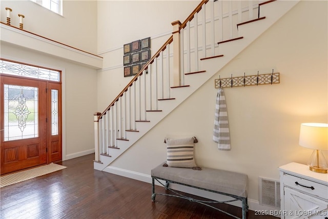 915 Bear Cave Way, Camdenton, MO 65020 - entryway with healthy amount of natural light, baseboards, dark wood finished floors, stairs, and a high ceiling
