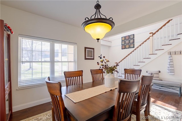 915 Bear Cave Way, Camdenton, MO 65020 - dining room featuring wood finished floors, baseboards, and stairs
