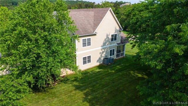 915 Bear Cave Way, Camdenton, MO 65020 - view of side of property with a yard and central AC unit