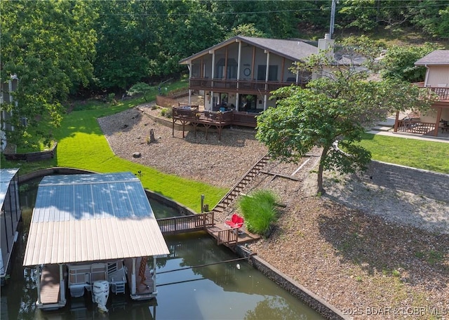 2151 Portside Ln, Osage Beach, MO 65065 - dock area featuring stairs, a deck with water view, and a lawn