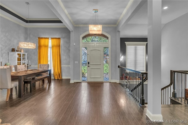 5938 N Chatham Ave, Kansas City, MO 64151 - entrance foyer featuring baseboards, crown molding, and wood finished floors