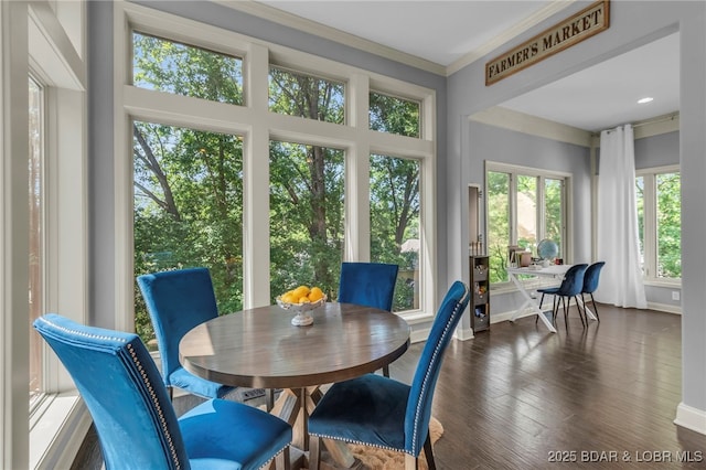 5938 N Chatham Ave, Kansas City, MO 64151 - dining area featuring crown molding, dark wood finished floors, and baseboards