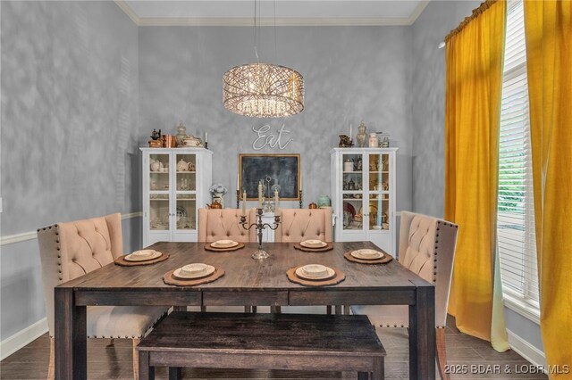 5938 N Chatham Ave, Kansas City, MO 64151 - dining area featuring wood finished floors, a chandelier, baseboards, and crown molding