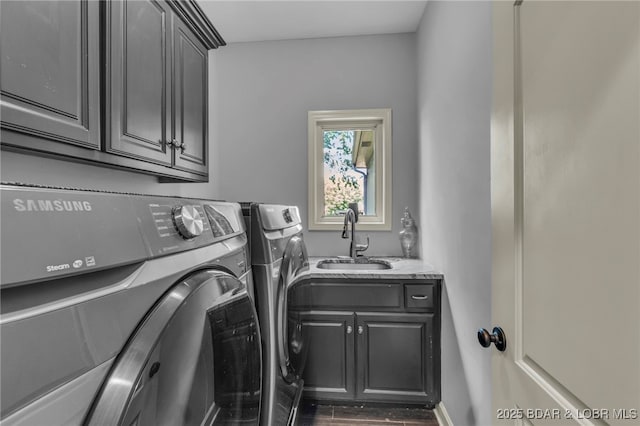 5938 N Chatham Ave, Kansas City, MO 64151 - laundry area featuring cabinet space, independent washer and dryer, and wood finished floors