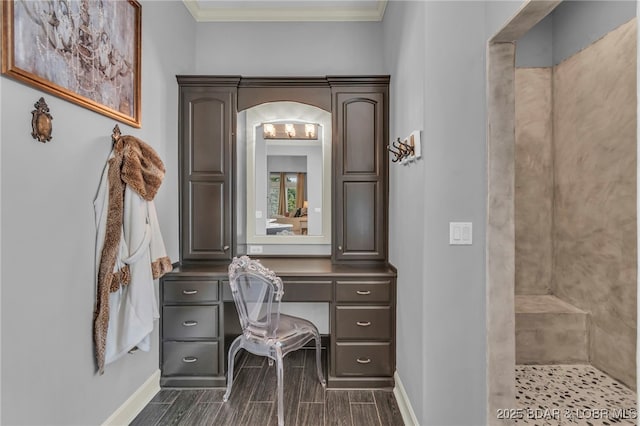 5938 N Chatham Ave, Kansas City, MO 64151 - home office featuring baseboards, crown molding, arched walkways, and wood finish floors