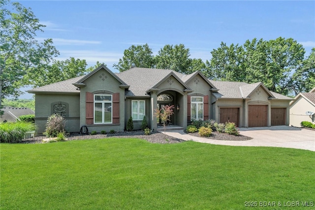 5938 N Chatham Ave, Kansas City, MO 64151 - ranch-style home with a garage, driveway, a front yard, and stucco siding