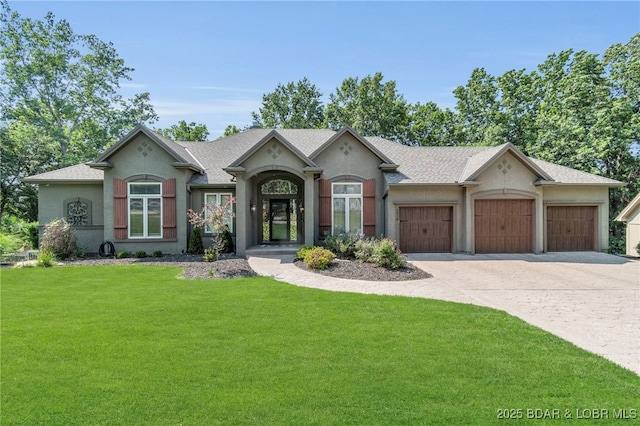 5938 N Chatham Ave, Kansas City, MO 64151 - view of front of home with a garage, a front lawn, driveway, stucco siding, and a shingled roof