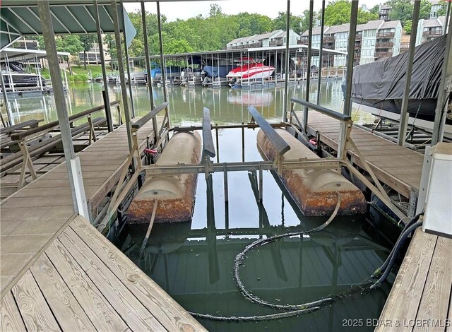 199 Bristol Bay Dr Unit 2A, Lake Ozark, MO 65049 - dock with boat lift and a water view