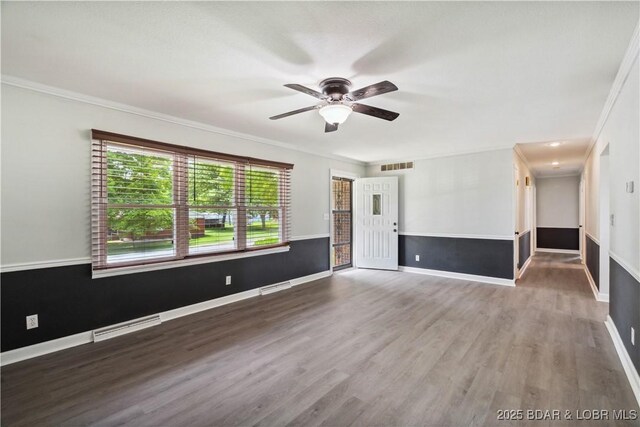 107 Haynes St, Eldon, MO 65026 - unfurnished living room with ceiling fan, ornamental molding, wood finished floors, and baseboards