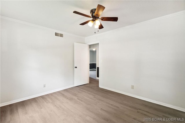 107 Haynes St, Eldon, MO 65026 - spare room with wood finished floors, a ceiling fan, ornamental molding, and baseboards
