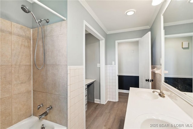 107 Haynes St, Eldon, MO 65026 - bathroom with double vanity, wood finished floors, tile walls, shower / tub combination, and crown molding