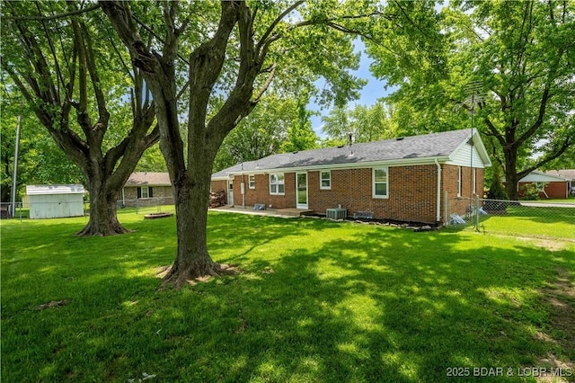 107 Haynes St, Eldon, MO 65026 - back of house featuring brick siding, a patio, and central air condition unit