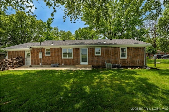 107 Haynes St, Eldon, MO 65026 - rear view of property with a patio and brick siding