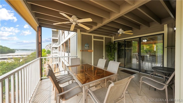 611 Lazy Days Rd Unit W1, Osage Beach, MO 65065 - sunroom featuring a ceiling fan, a water view, outdoor dining area, and beam ceiling