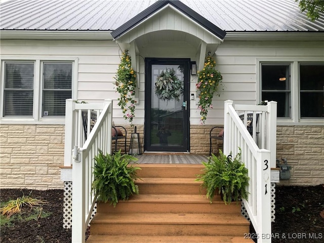 301 Burke St, Versailles, MO 65084 - entrance to property with stone siding and metal roof