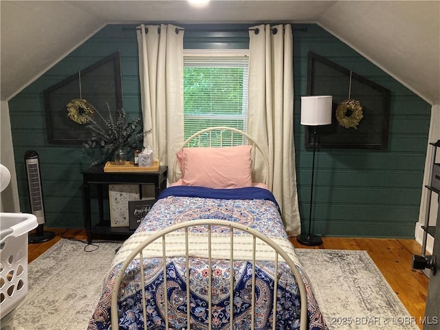 301 Burke St, Versailles, MO 65084 - bedroom with lofted ceiling and wood finished floors