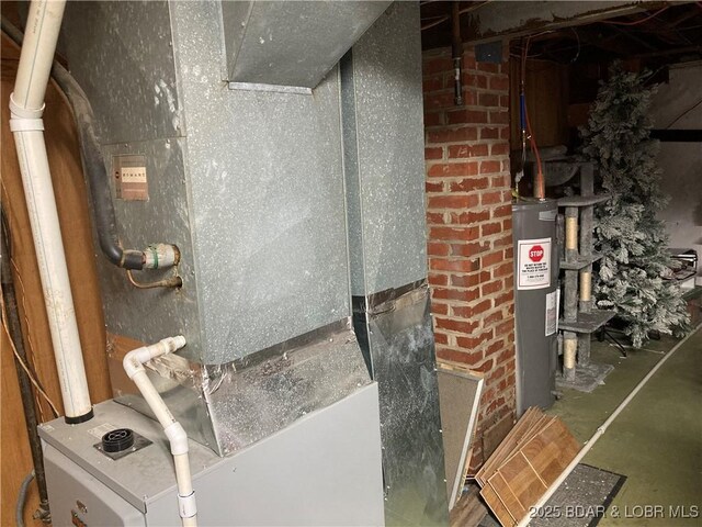 301 Burke St, Versailles, MO 65084 - utility room with water heater and heating unit