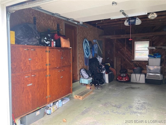 301 Burke St, Versailles, MO 65084 - garage featuring a garage door opener