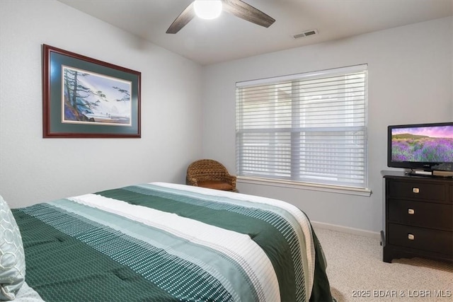 4800 Eagleview Dr Unit 115B, Osage Beach, MO 65065 - bedroom with multiple windows, carpet, baseboards, and ceiling fan