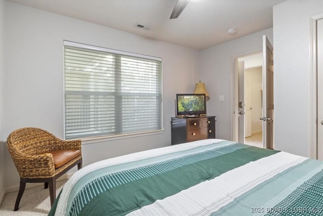 4800 Eagleview Dr Unit 115B, Osage Beach, MO 65065 - bedroom featuring light colored carpet, multiple windows, baseboards, and a ceiling fan