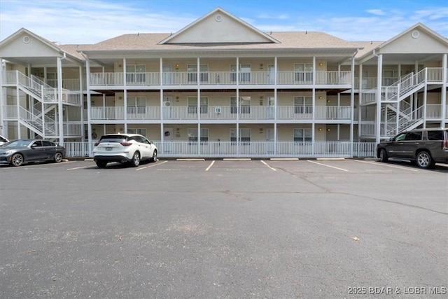 4800 Eagleview Dr Unit 115B, Osage Beach, MO 65065 - view of apartment building / complex featuring uncovered parking