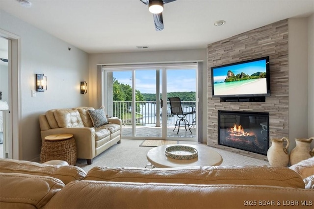 4800 Eagleview Dr Unit 115B, Osage Beach, MO 65065 - living room with a fireplace and carpet flooring