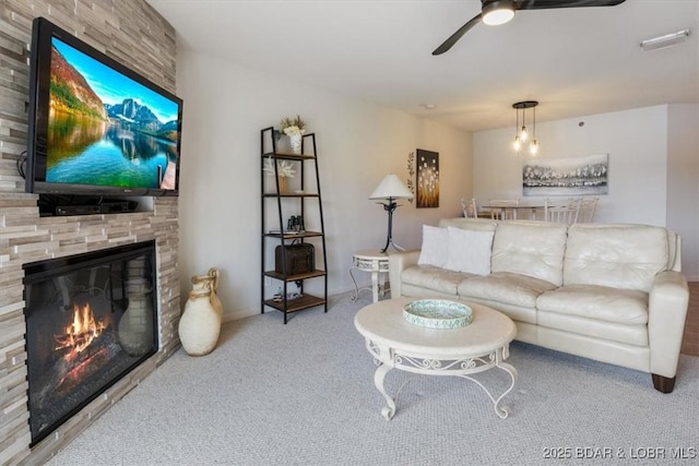 4800 Eagleview Dr Unit 115B, Osage Beach, MO 65065 - carpeted living room with a ceiling fan and a fireplace