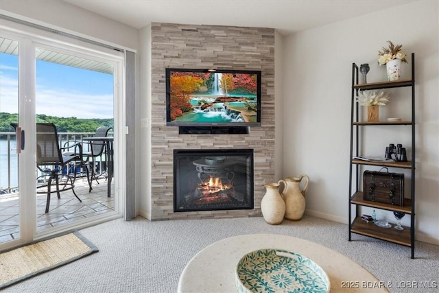4800 Eagleview Dr Unit 115B, Osage Beach, MO 65065 - living area with carpet floors, a tiled fireplace, and baseboards