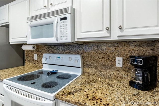 4800 Eagleview Dr Unit 115B, Osage Beach, MO 65065 - kitchen featuring white appliances, white cabinetry, and tasteful backsplash