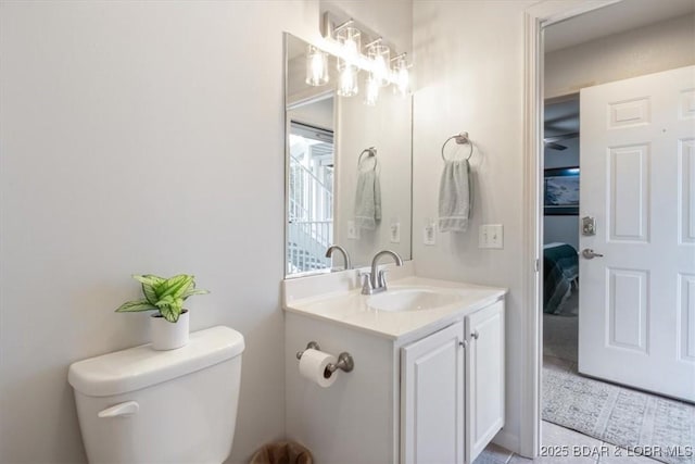 4800 Eagleview Dr Unit 115B, Osage Beach, MO 65065 - bathroom with vanity, toilet, and tile patterned floors