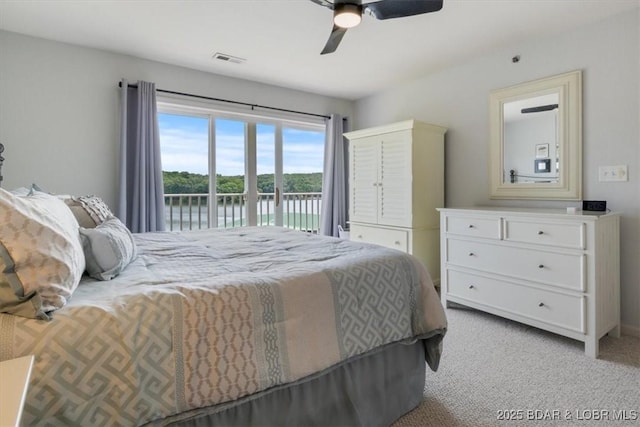 4800 Eagleview Dr Unit 115B, Osage Beach, MO 65065 - bedroom with access to outside, light carpet, a water view, and a ceiling fan
