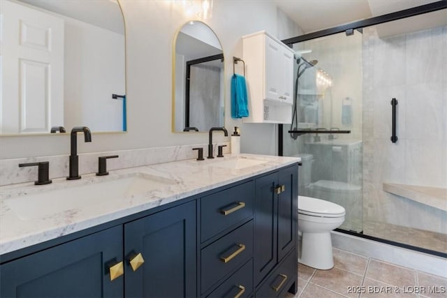 4800 Eagleview Dr Unit 115B, Osage Beach, MO 65065 - full bathroom with toilet, tile patterned floors, double vanity, and a shower stall