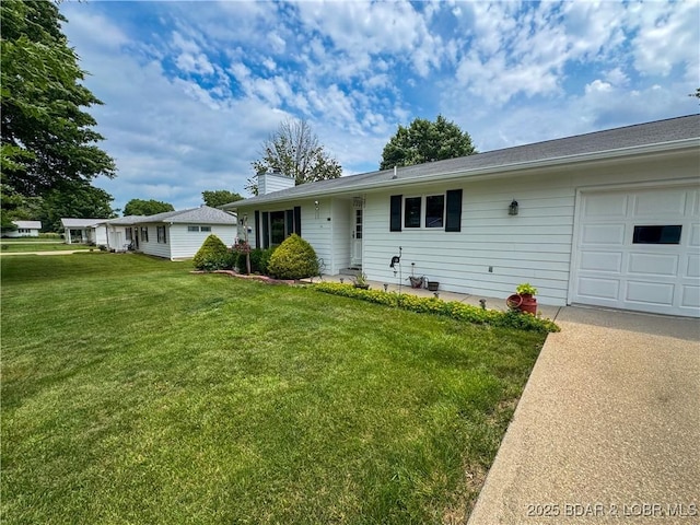 104 Tower View Dr, Versailles, MO 65084 - single story home featuring a front lawn, a chimney, an attached garage, and concrete driveway