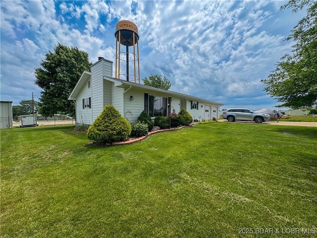 104 Tower View Dr, Versailles, MO 65084 - view of side of property featuring a yard and a chimney