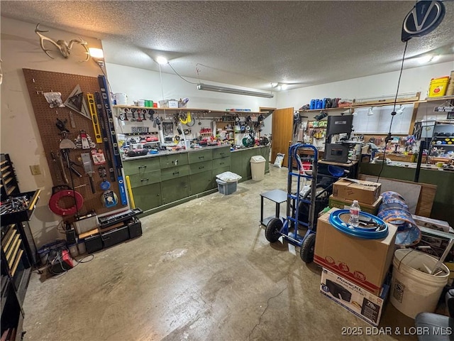 104 Tower View Dr, Versailles, MO 65084 - basement featuring a workshop area and a textured ceiling