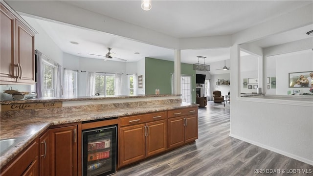 166 Joy Cir, Camdenton, MO 65020 - kitchen with ceiling fan, beverage cooler, dark wood-type flooring, and open floor plan