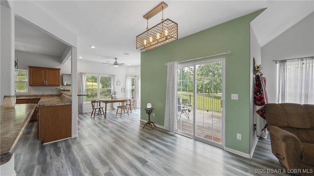 166 Joy Cir, Camdenton, MO 65020 - kitchen with brown cabinets, wood finished floors, a ceiling fan, baseboards, and recessed lighting