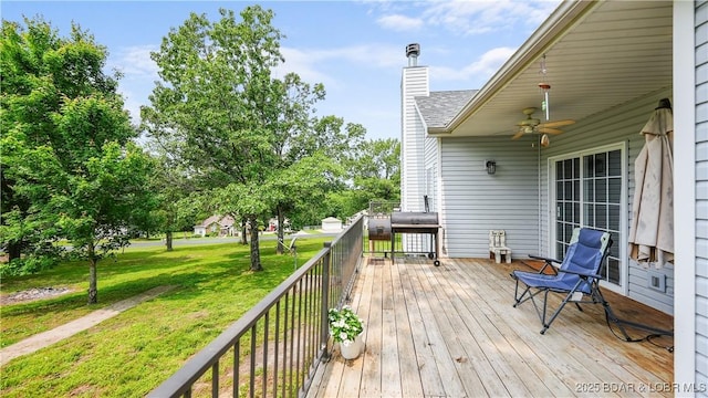 166 Joy Cir, Camdenton, MO 65020 - deck with a lawn, ceiling fan, and area for grilling