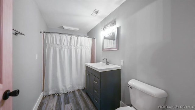 166 Joy Cir, Camdenton, MO 65020 - bathroom with vanity, toilet, wood finished floors, and curtained shower