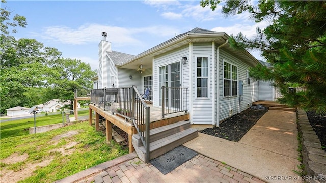 166 Joy Cir, Camdenton, MO 65020 - rear view of property featuring a deck and a chimney