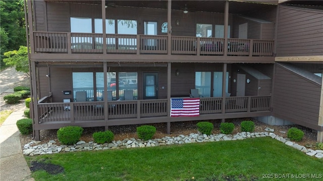 149 Sycamore Beach Rd Unit C1, Camdenton, MO 65020 - rear view of property with a yard and a balcony