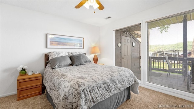 149 Sycamore Beach Rd Unit C1, Camdenton, MO 65020 - bedroom featuring light colored carpet, access to outside, baseboards, and a ceiling fan