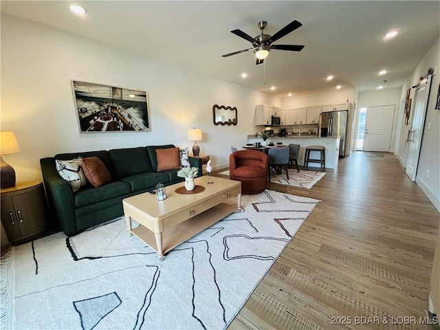 295 Highland Shores Dr Unit 2D, Lake Ozark, MO 65049 - living room with light wood-style floors, a ceiling fan, recessed lighting, and baseboards