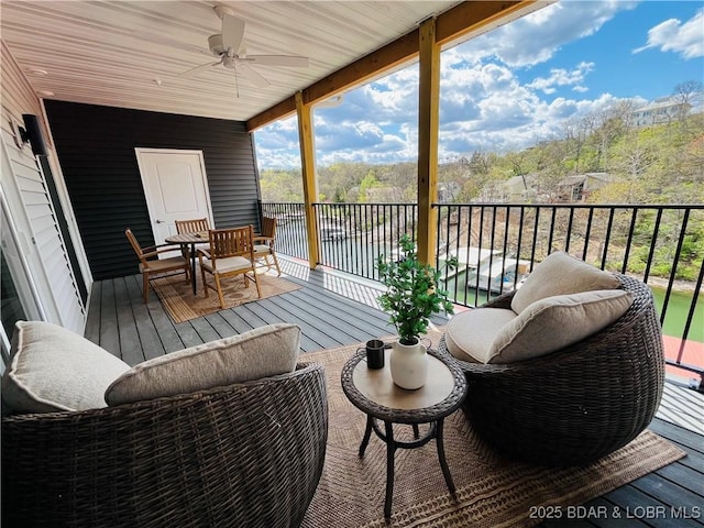 295 Highland Shores Dr Unit 2D, Lake Ozark, MO 65049 - deck featuring a water view and a ceiling fan